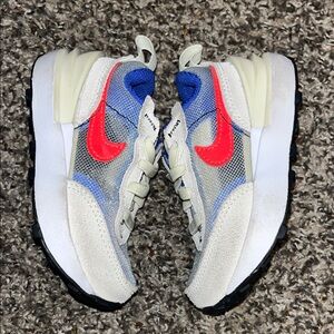 NIKE Kids Stylish Sneakers with Red and Blue Accents